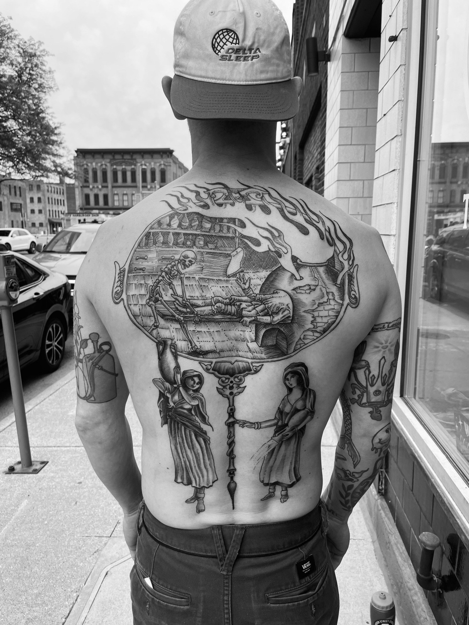 Black-and-gray skeleton scene back tattoo by Dom at Last Hope Tattoo Company in Toledo