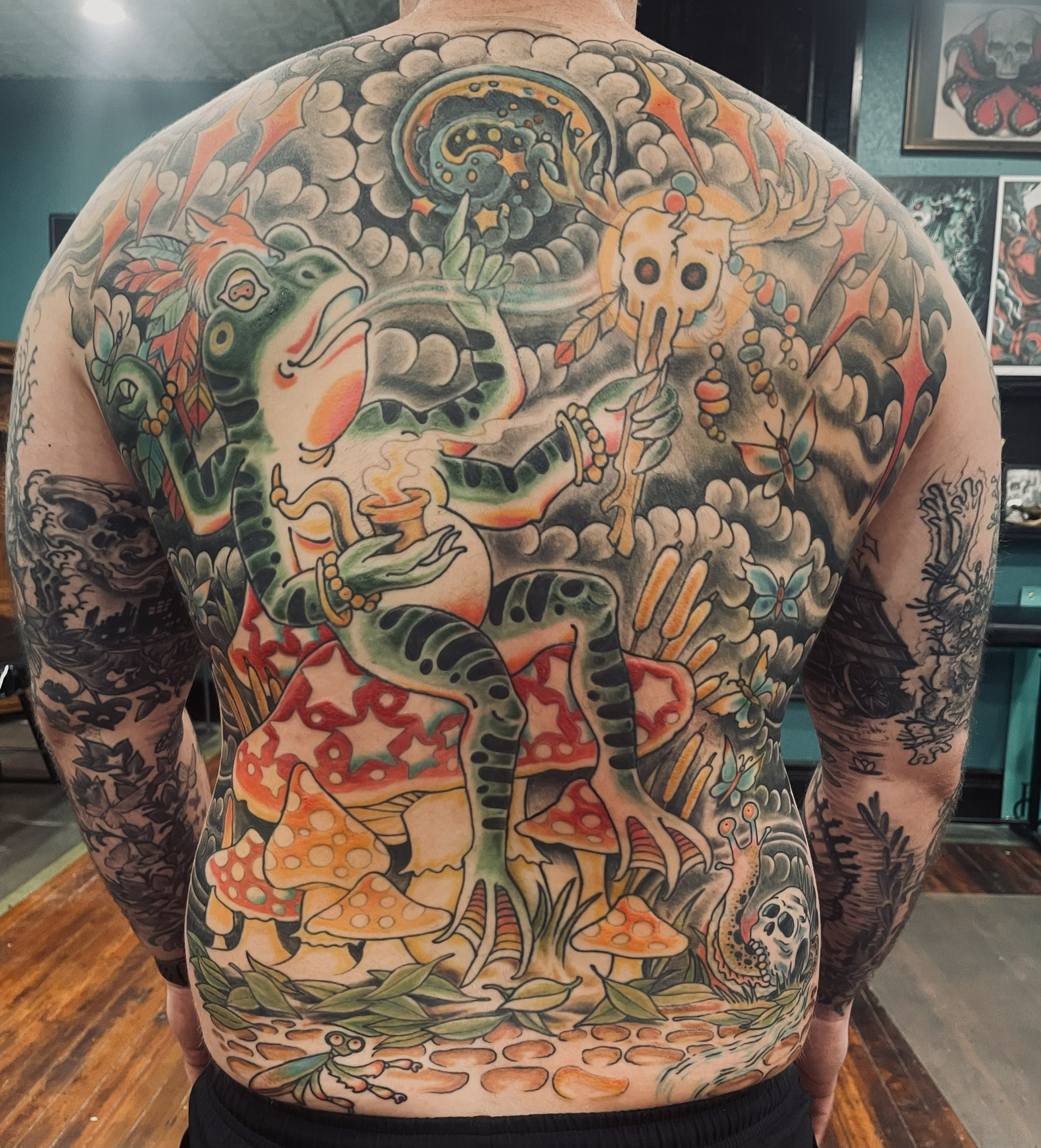 Color frog mushroom back tattoo by Dom at Last Hope Tattoo Company in Toledo