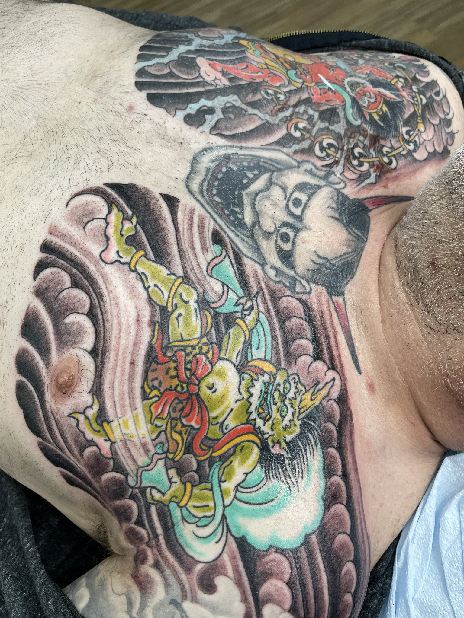 Japanese folklore chest piece detail by Dom at Last Hope Tattoo Company in Toledo